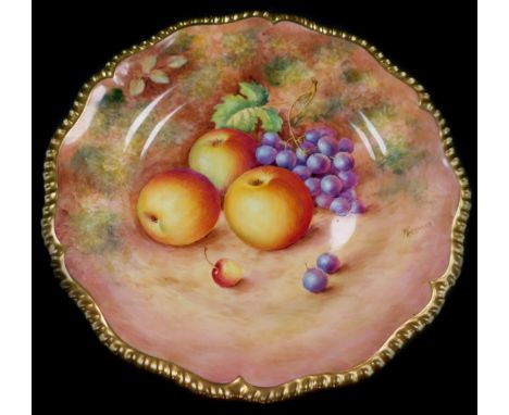 A Royal Worcester porcelain cabinet plate, signed Freeman,  painted with apples and black grapes, 25cm diameter.