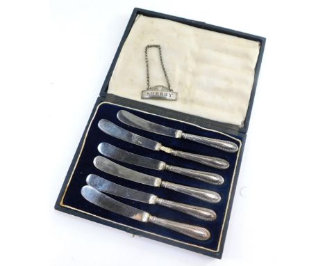 A Victorian silver sherry decanter label, William Summers, London 1875, and six George V silver handled cake knives, cased, S