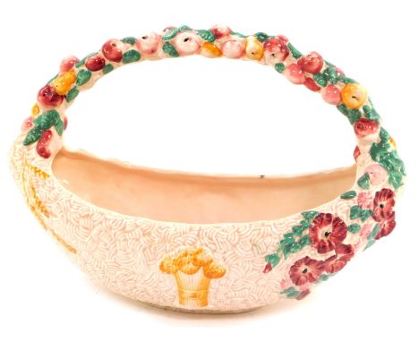 A Clarice Cliff pottery basket decorated in the Celtic Harvest pattern, of ovoid form, pink ground, printed mark.