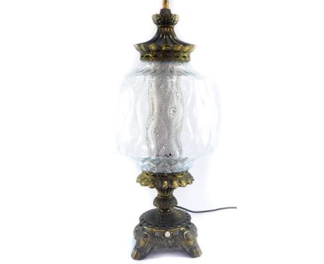 A Continental 20thC brass table lamp, with a clear cut glass shade and brass cap, 63cm high.