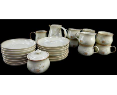 A Denby pottery part tea service decorated in the Daybreak pattern, comprising milk and cream jugs, sucrier, eight cups, sauc