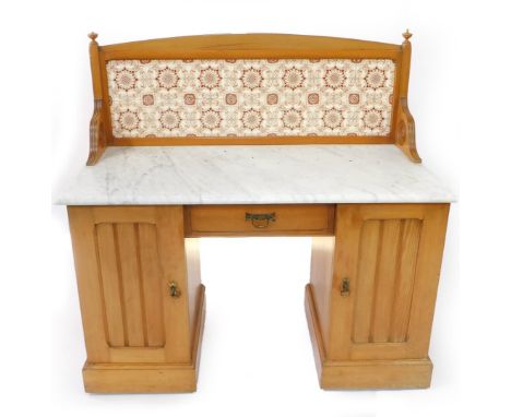 A Victorian ash and marble topped washstand, with tile splash black, inset with brown floral tiles, above a frieze drawer fla