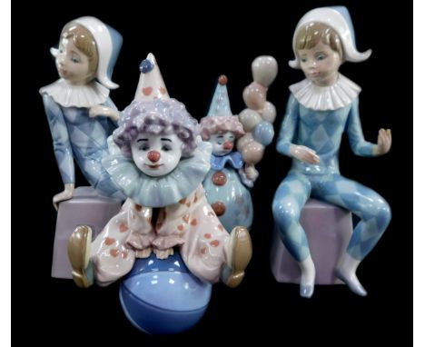 Two Lladro porcelain clown figures modelled as Littlest Clown and Having A Ball, boxed, and two Lladro Harlequins, letters A 