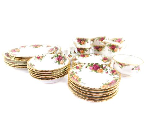 A Royal Albert porcelain part dinner and tea service decorated in the Old Country Roses pattern, comprising three dinner and 