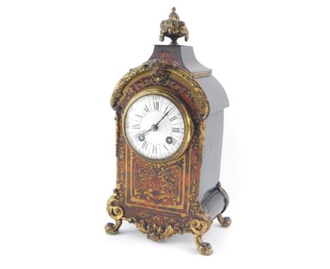 A French late 19thC Boulle mantel clock, circular enamel dial bearing Roman and Arabic numerals, eight day movement with coil