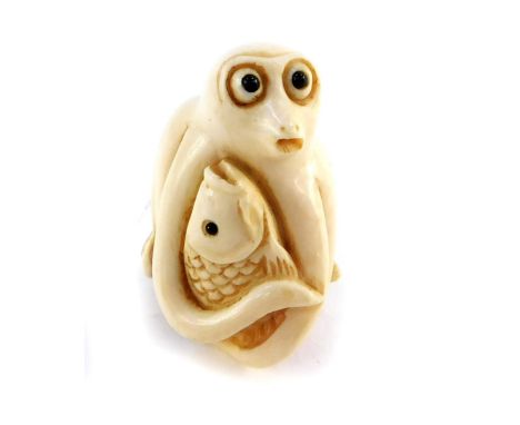 A Japanese late Taisho / early Showa  period  ivory netsuke of an octopus and carp  entwined, signed, 36mm high.