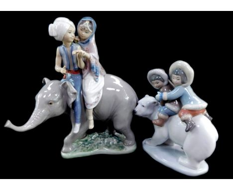 A Lladro porcelain figure modelled as Eskimo Riders, and a further figure group modelled as Hindu children riding an elephant