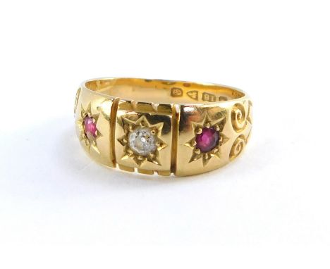 An Edwardian lady's 18ct gold diamond and ruby three stone ring, size M, 4.2g.