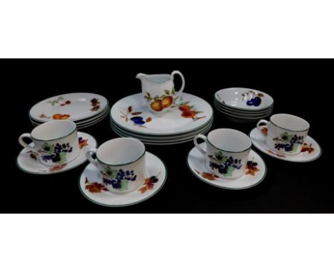 A group of Royal Worcester decorated in the Evesham Vale pattern, comprising four dinner and four side plates, four fruit bow