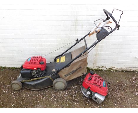 A Champion Premier self propelled lawn mower, with Honda engine and spare.