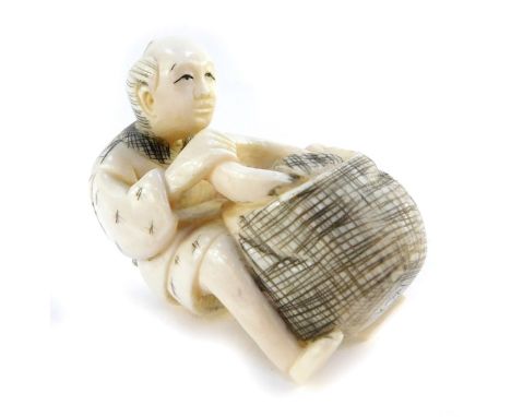 A Japanese Taisho period Japanese ivory netsuke of a man with a basket and bowl, unsigned, 42mm high.