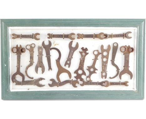 Motorcycle and automobile spanners, for BSA, Regent, Austin, framed, together with hand tools. 