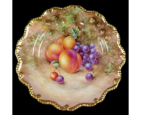 A Royal Worcester porcelain cabinet plate, signed M Johnson, painted with peaches and black grapes, 23cm diameter.