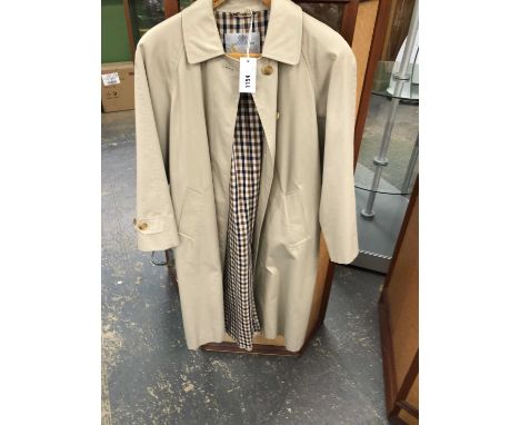 An Aquascutum trench coat together with a small quilted Aquascutum coat and a blouse and matching dress(3)