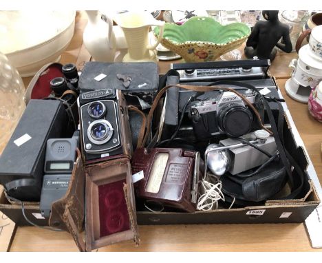Canon and Yashica cameras, binoculars, a Roberts radio, a Motorola telephone hand set, a bakelite case electrical resistance 