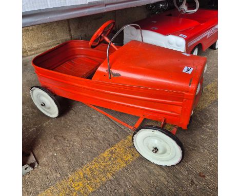 A Vintage Tri-Ang Comet, tinplate pedal car.
