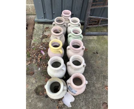Eleven terracotta urn-form jars.