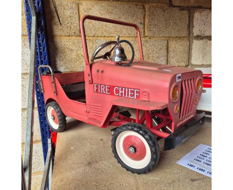 Vintage Tin Plate pedal car in the form of a a Fire chief Jeep.