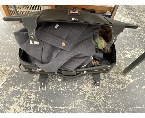A suitcase containing a RAF great coat, uniform, camouflaged fatigues, etc.