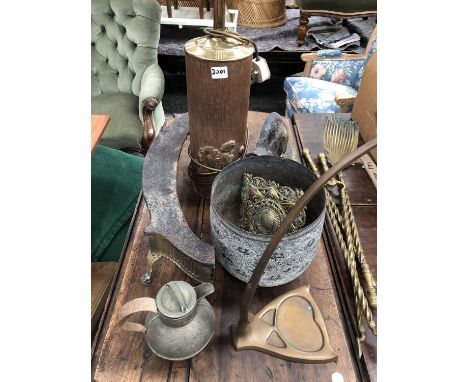 A brass planter, a table lamp, brass fire irons, a fender, a painted iron cat doorstop, etc.