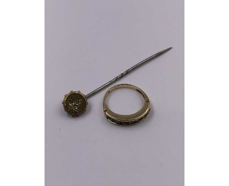 A 9ct hallmarked gold peridot channel set half eternity ring and a gem set stick pin unhallmarked assessed as 15ct gold head 
