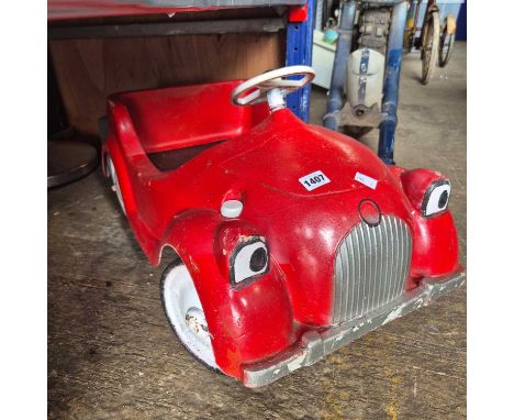 A Vintage Tri-Ang "Chubby" plastic pedal car.