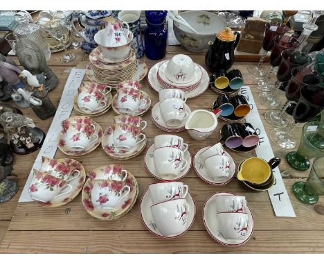 Crown Devon leaping deer pattern tea and coffee wares, a Doulton floral tea set, a Palissy coffee set, etc.