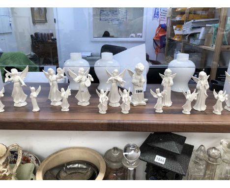 A collection of Dresden white glazed musical and praying angels