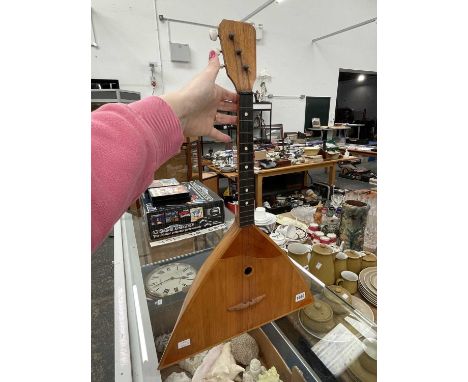 An inlaid wood three string balalaika
