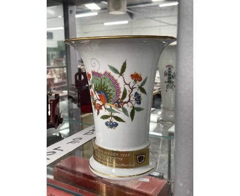 A 1960's Meissen floral beaker vase bearing a brass prize presentation label for 250cc racing. Height 19.3 cm.