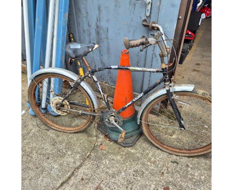 A vintage gent's bicycle and a Raleigh bomber bike.