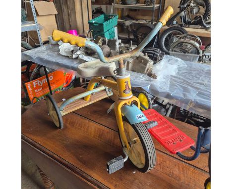A Raleigh childs tricycle and a Bantel scooter.