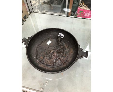 A Victorian iron two handled bowl with a central relief medallion of Britannia