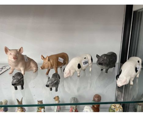 Five Doulton pigs together with two others by Beswick and Aynsley