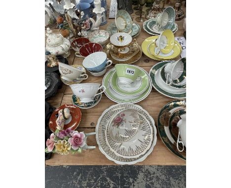 Miscellaneous German tea cups and saucers, bird figurines, wooden stands, etc.