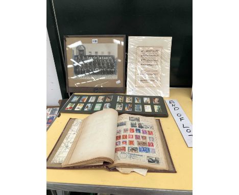 An Ace Herald stamp album, a cigarette card album, a Cornwall military photograph in a glazed frame, and a music sheet. 