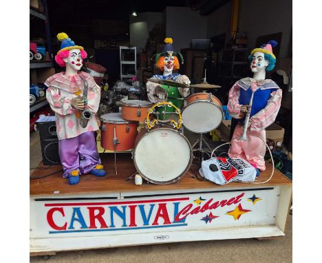 Carnival Cabaret. a Vintage 1980's? An automaton clown band on a wheeled wooden base. W 201 x D 705 x H 165 cm.