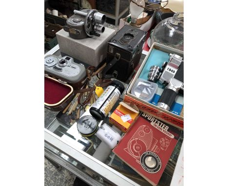 Movinette, Auto Carena and Bell and Howell cine cameras together with some accessories and a Zeiss box camera