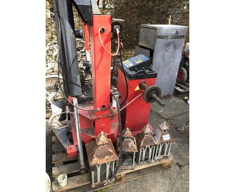 A hydraulic tyre changing machine.