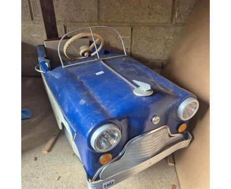 An unusual, Believed Tri-Ang tinplate pedal car, probably early 1960's, badged for Ford and fitted with usable headlights.
