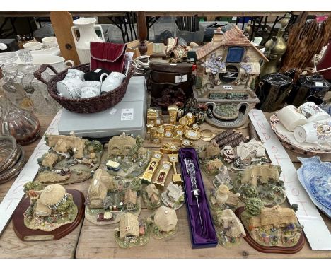 Lilliput Lane cottages, novelty clocks in gilt cases, a chalet form clock, a typewriter, binoculars, etc