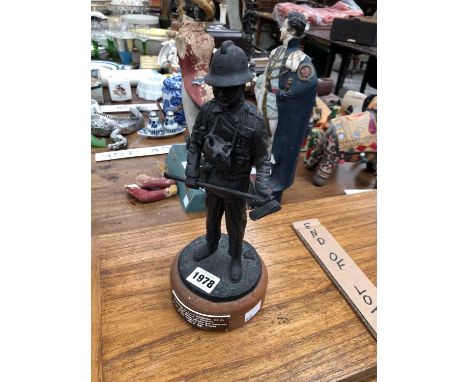 A 1991 presentation figure of a 1939 fireman with his axe