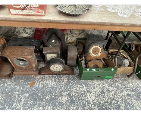 A collection of mantel clocks and clock parts