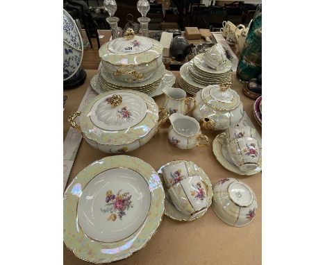 A Czech flower printed and lustred part tea and dinner service