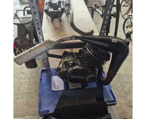 A Yamaha 2-stroke engine and exhaust.