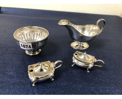 Hallmarked silver to include a sauce boat, a sugar bowl and two mustards with blue glass liners. Gross weight excluding liner