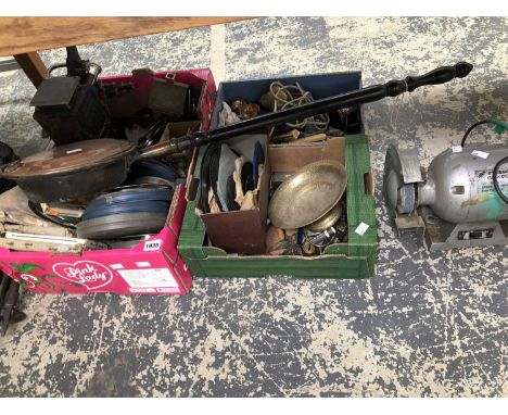An electric bench grinder, a copper warming pan, cans of film, a projector, a bag of bowls, shooting sticks, etc.