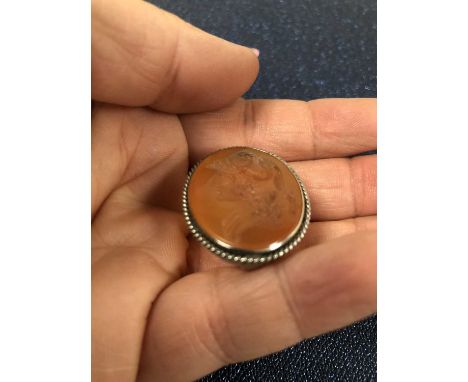 An antique carved carneilan portrait intaglio in a pendant/scarf mount. 