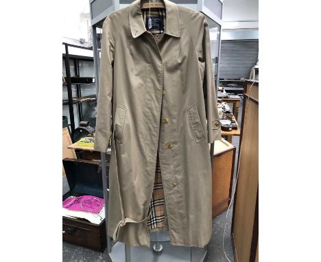 A lady's Burberry trench coat. size 14 extra long