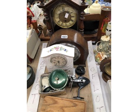 Noris and other fishing reels, fishing floats together with three mantel clocks